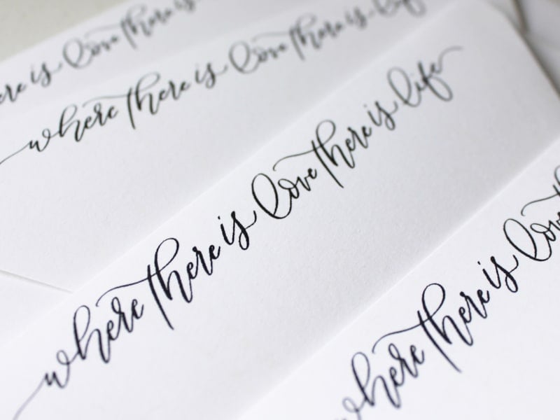 Custom calligraphy quote on envelopes