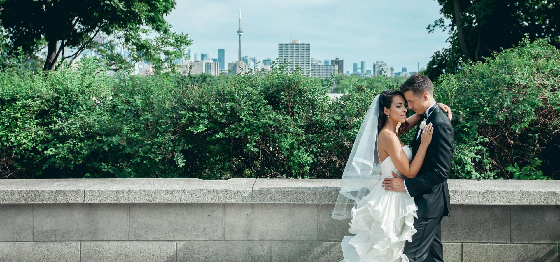 Hero image for Laura and Tomas’ All White Wedding in Casa Loma’s Glass Pavilion