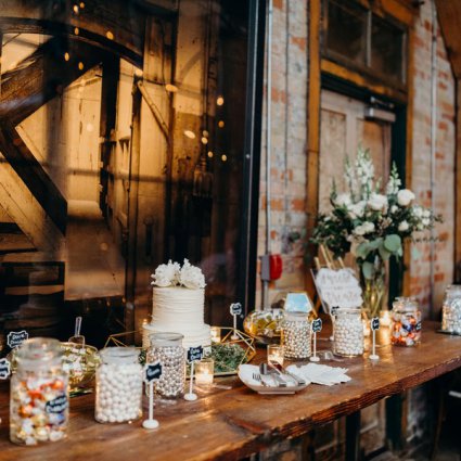 Prairie Girl Bakery featured in Megan and Zak’s Romantic Distillery Wedding at Archeo