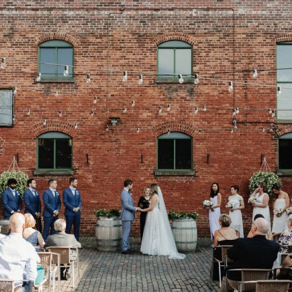 Enduring Promises featured in Cammie and Ryan’s Romantic Summer Wedding at Archeo