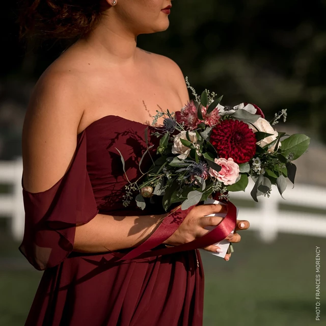 Bridesmaid Photo With White Picket Fence in Background