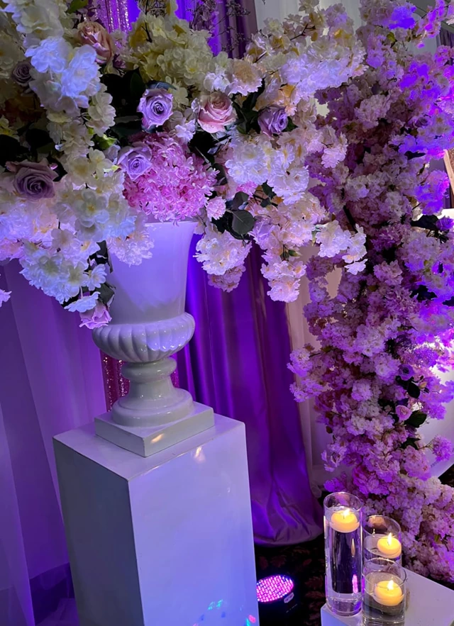 CHAMELEON EVENTS lighting packages accent large custom florals for this set up. Think colour and your guests will love you for it!