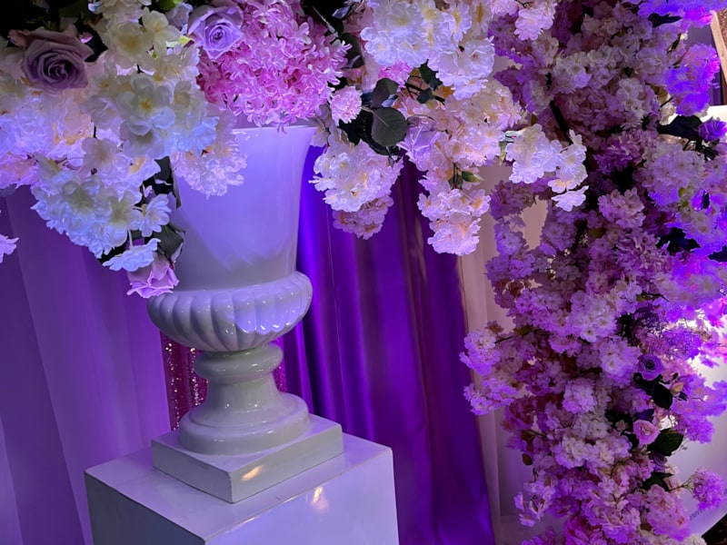 CHAMELEON EVENTS lighting packages accent large custom florals for this set up. Think colour and your guests will love you for it!