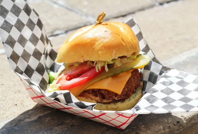 Veggie Mac, house chickpea & black patty, iceberg lettuce, bread & butter pickles, tomatoes, MAC sauce