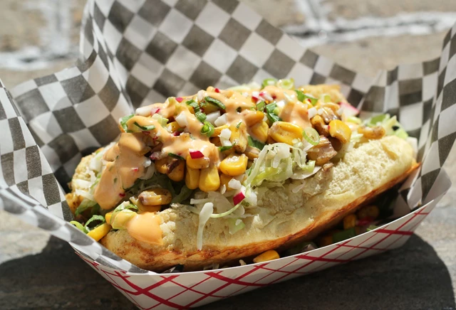 Jamaican Me Crazy-jerk chicken, roasted corn, pickled cabbage, baby greens, pineapple jalapeno sauce