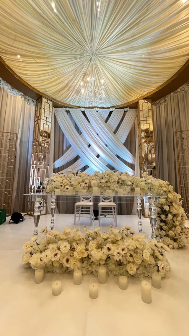 8ft Acrylic Table and White Phoenix Chairs for the couples table.