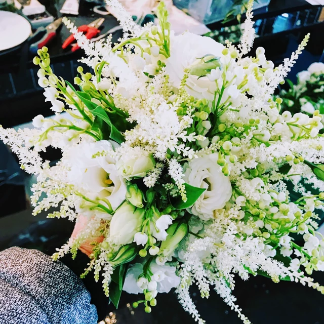 Lily of the valley, lisianthus and sweet pea bouquet