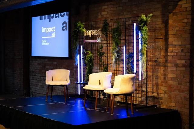 Gridwall greenery decor, adding a touch of nature and elegance to the corporate event, creating a fresh and modern atmosphere.