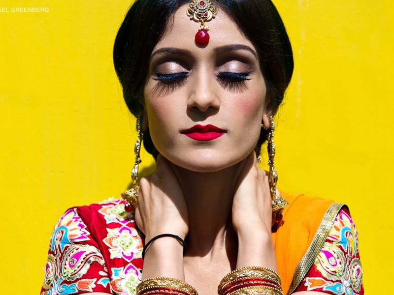 A colourful wedding portrait of a Sikh Bride