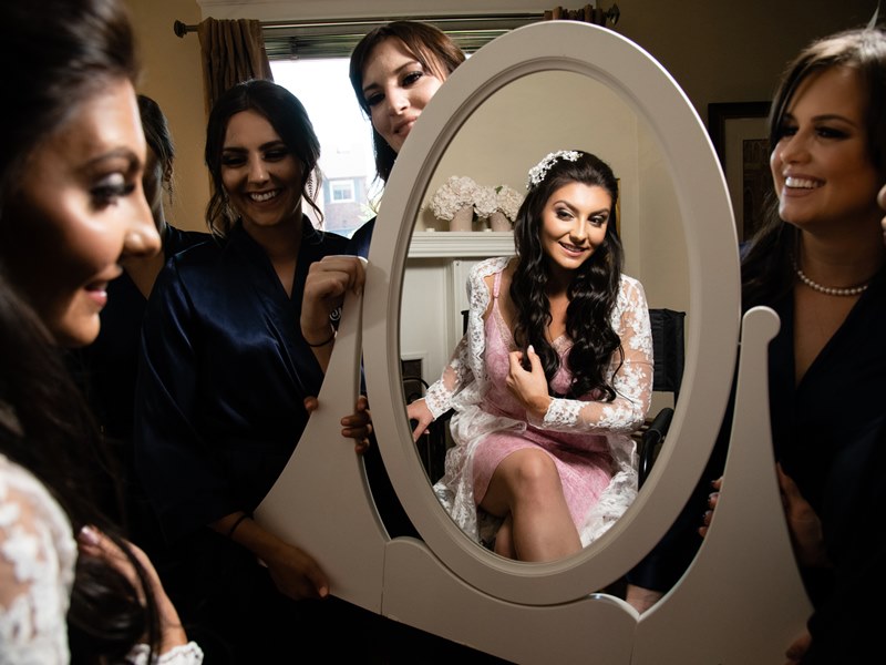 A different approach to capturing the wedding preparations of the bride with bridesmaids. 