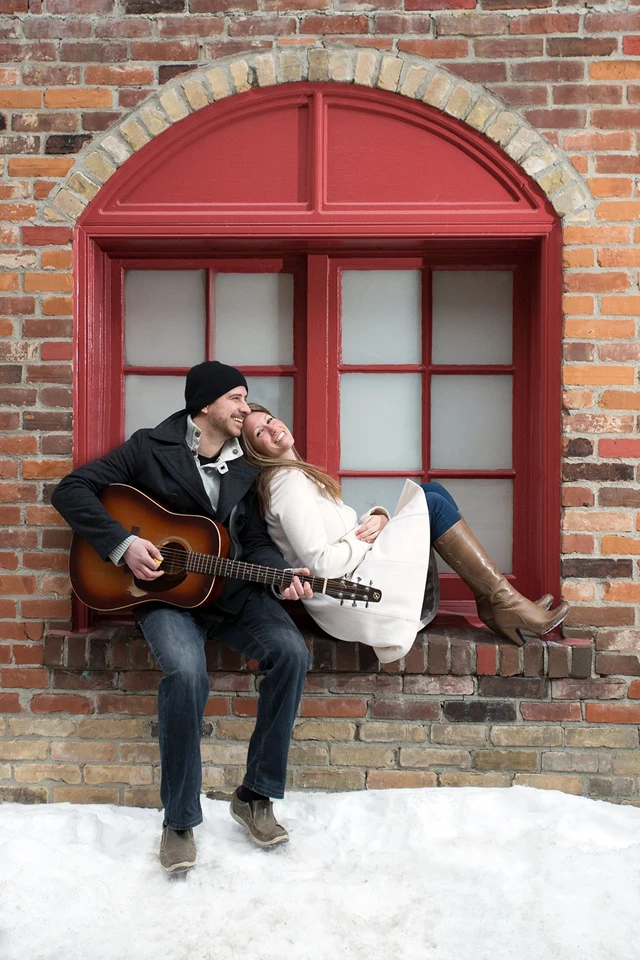 Black and white photo of a bride and groom about to kiss.