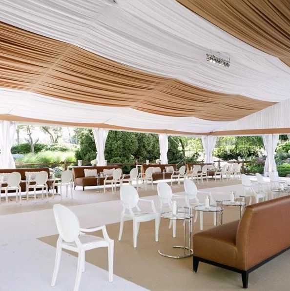 A custom tent floor of tan and chalk event carpet