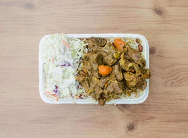 Curry Chicken Plate with Coleslaw on Rice and Peas