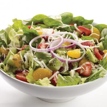 Sunshine Salad: Baby spinach, romaine lettuce, red onion, kiwi, strawberries, dried cranberries, mandarin oranges, grated mozzarella cheese and sunflower seeds, with a citrus kiwi dressing.