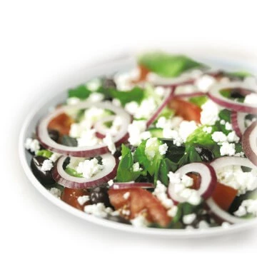 Greek Salad: Romaine lettuce tossed with feta, kalamata olives, tomatoes, cucumbers and red onion with a choice of our creamy Greek Feta dressing or Feta vinaigrette.