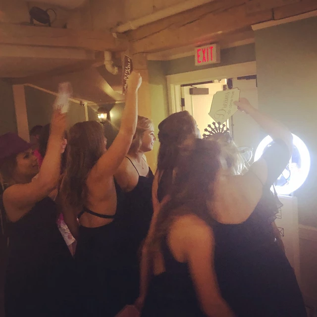 Bride & bridesmaids having fun on our photo booth.