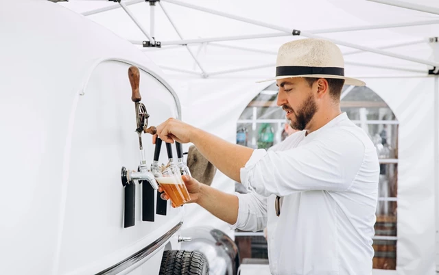 Our bartender pouring a beer
