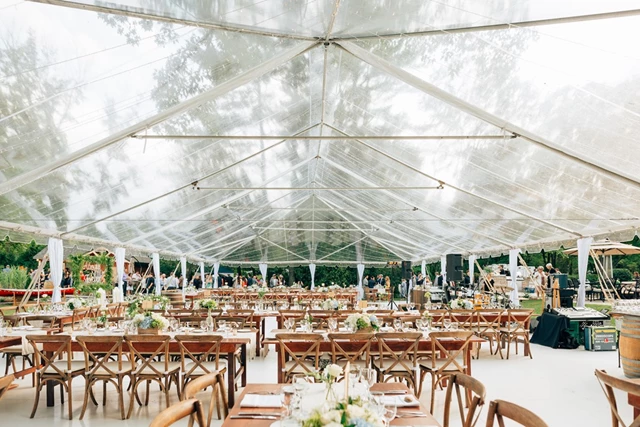 Clear Top Tent with Cross Back Chairs and Harvest Tables